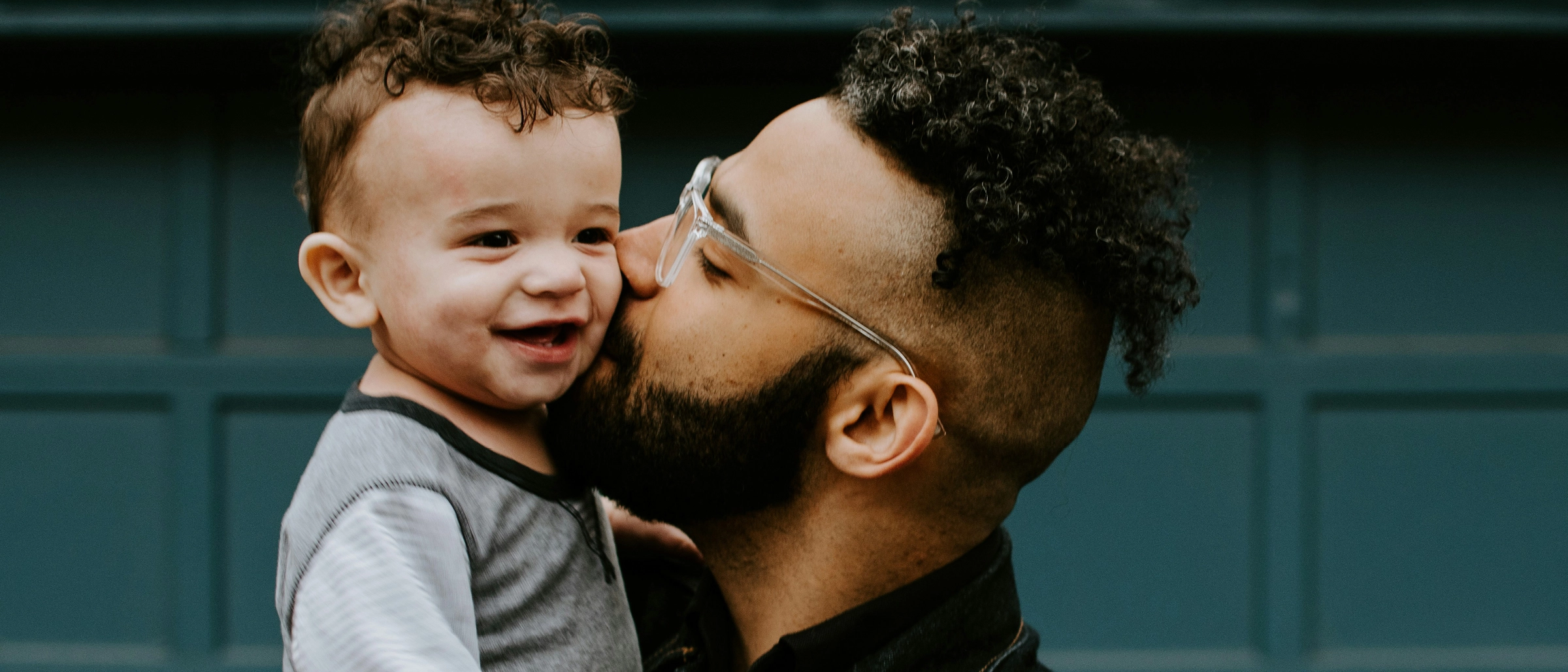 Man and boy hugging