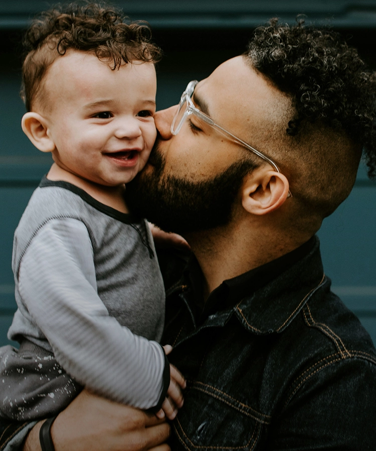 Man and boy hugging