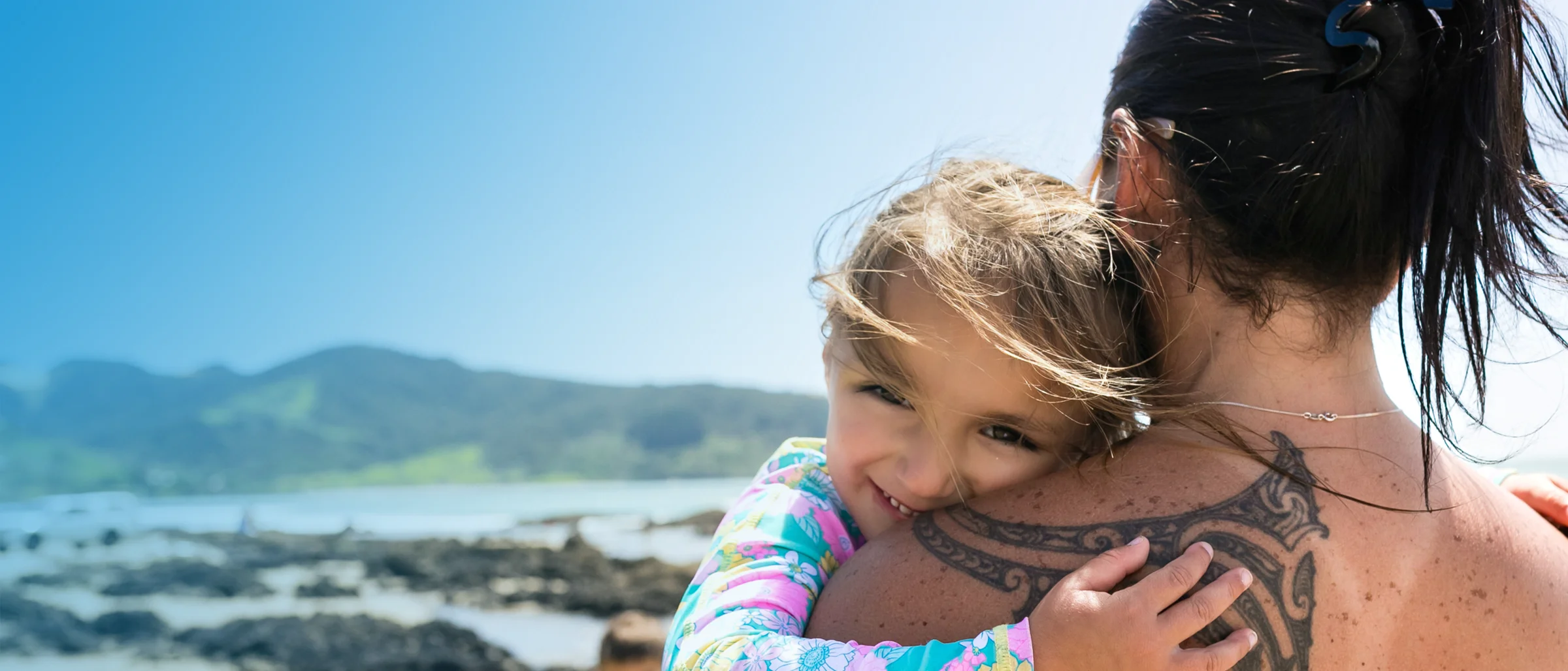 A mother and daughter hugging