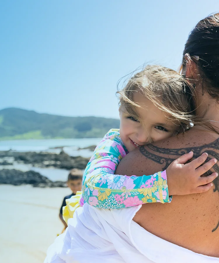 A mother and daughter hugging