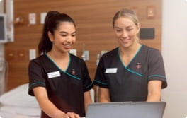 Two nurses discuss work