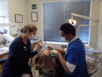 A dentist working on a patient