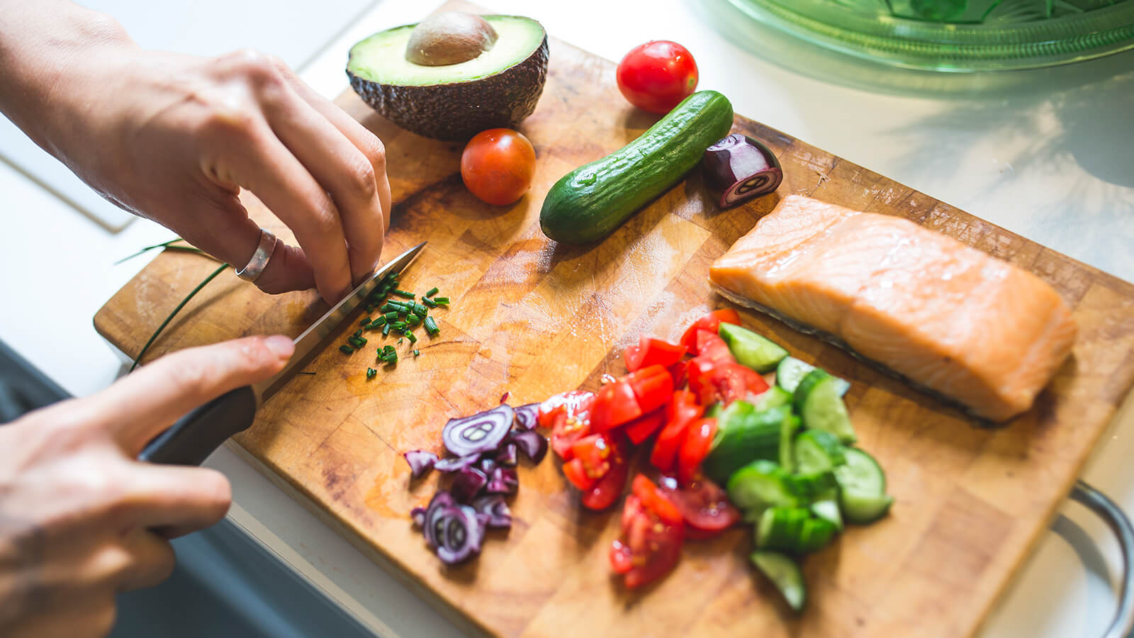 A chopping board of fruit and fish