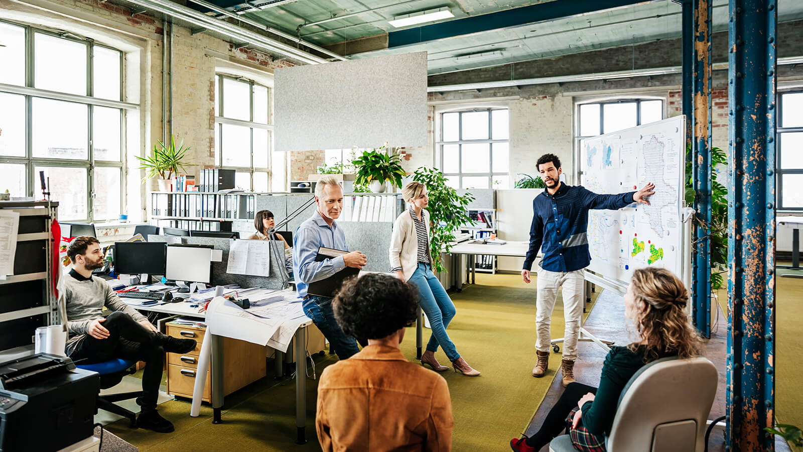 A man gives a presentation in an office