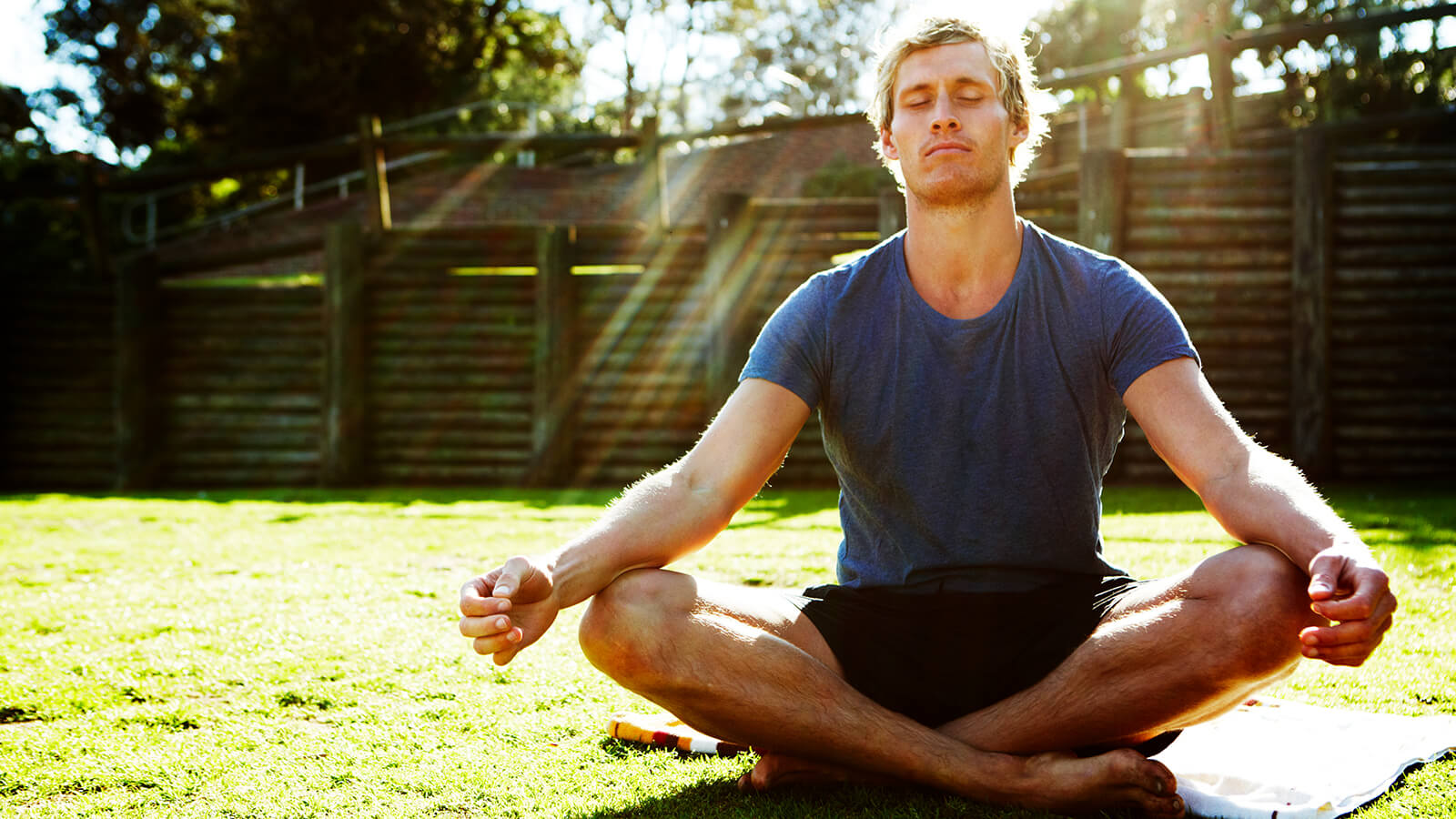 A man meditates in the garden