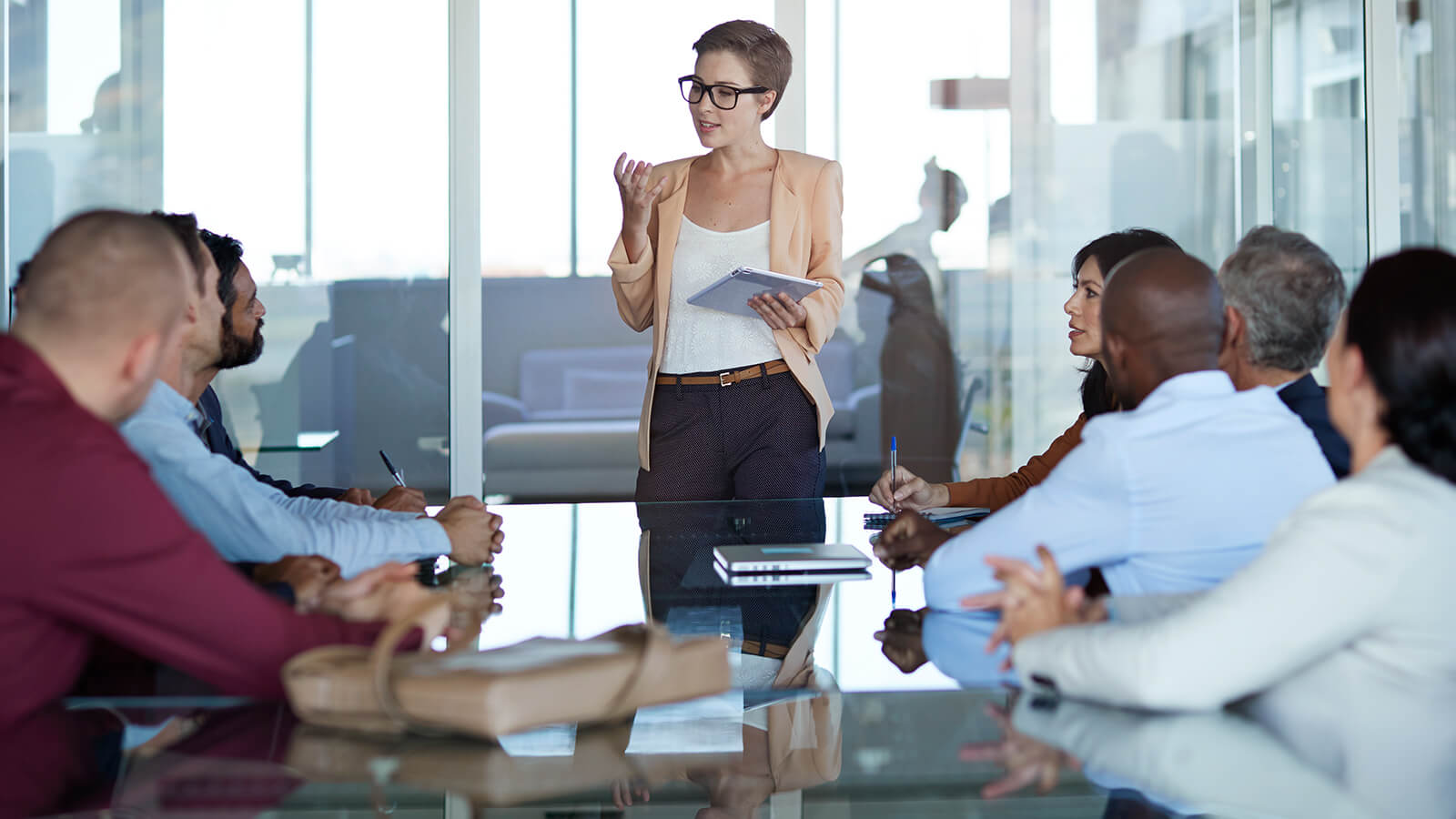 A woman delivers a speech in a meeting room