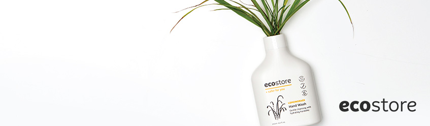 An ecostore bottle with a plant growing out of the top