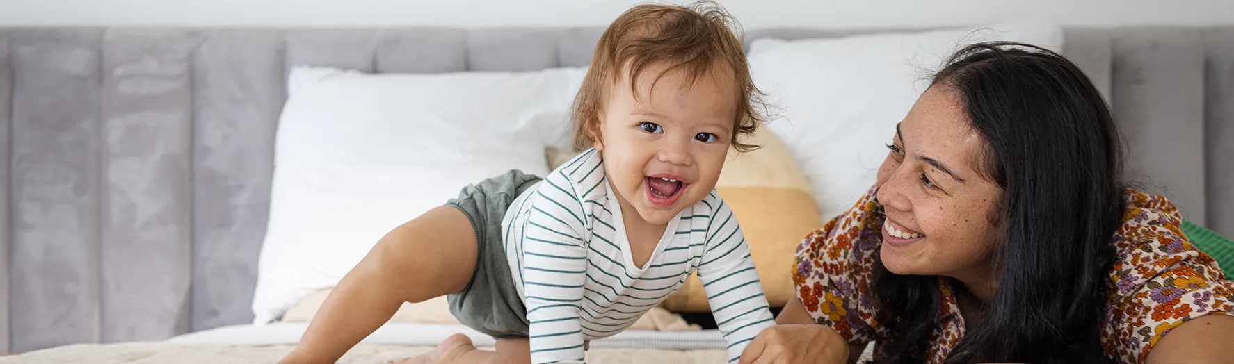 A mother and her baby laughing