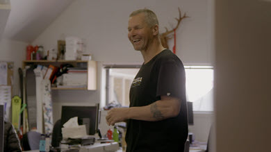 A man laughing with his friend