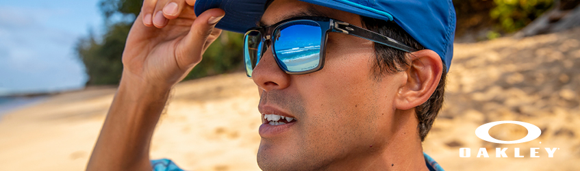 A close up shot of a man with Oakley sunglasses