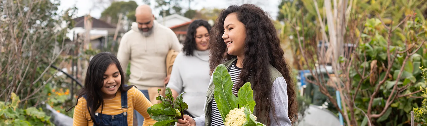 A family picking vegetables together